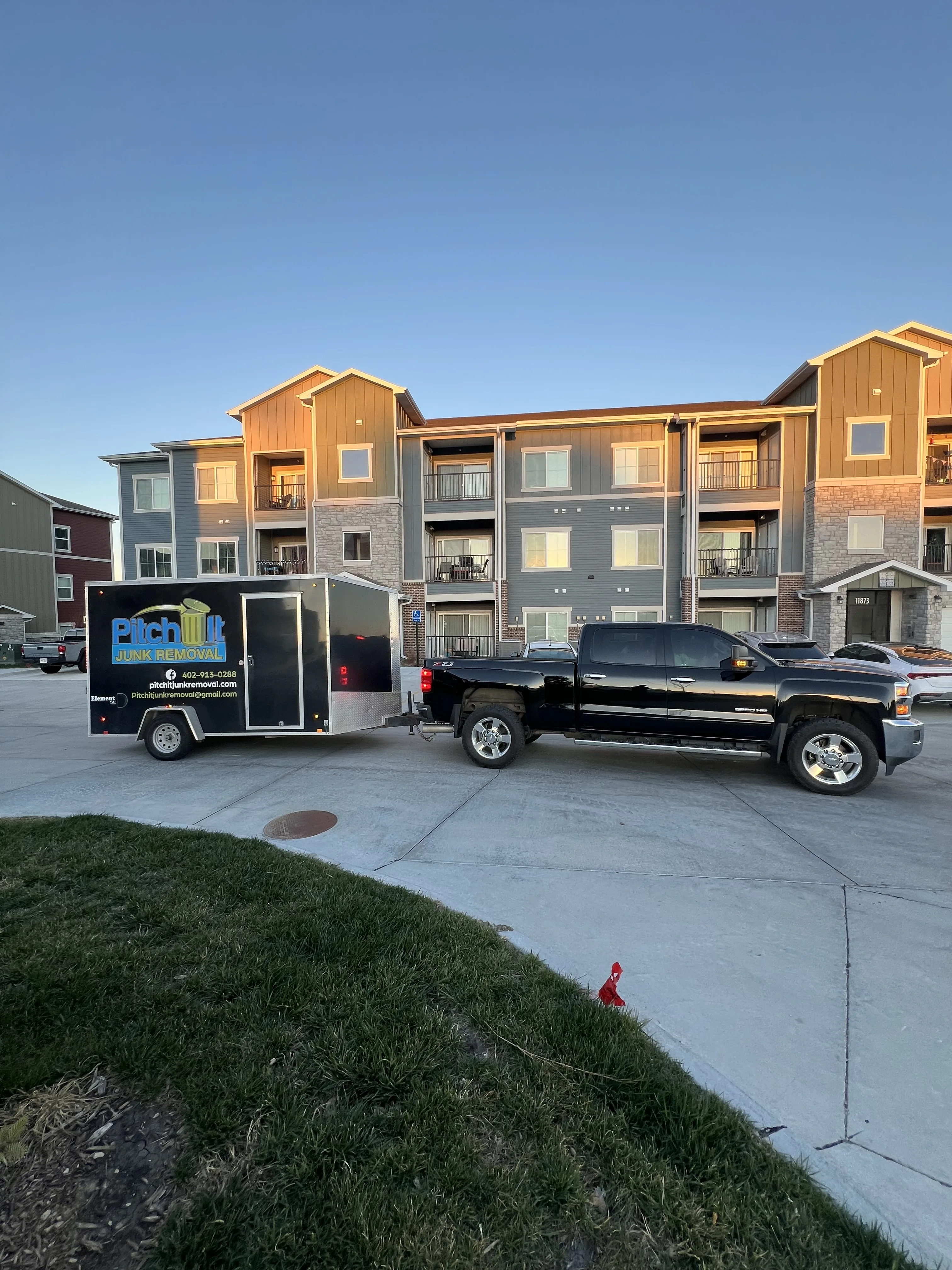 Professional Pitch It Junk Removal truck and trailer providing junk removal services in Omaha and surrounding areas